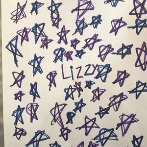 It is a piece of paper with blue and purple stars made bye hand.